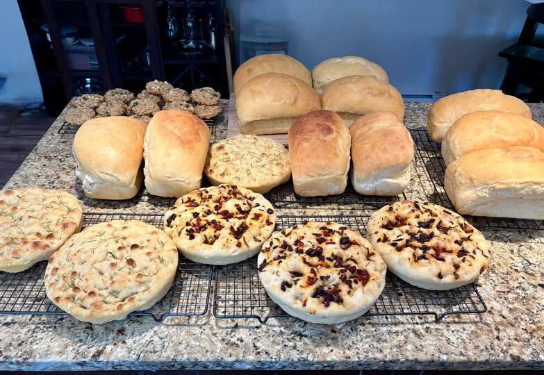 A table full of fresh bread and treats