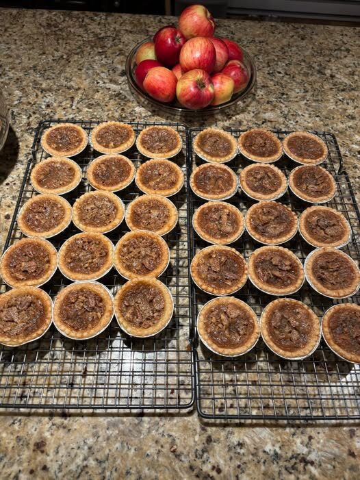 Freshly baked muffins cooling on racks